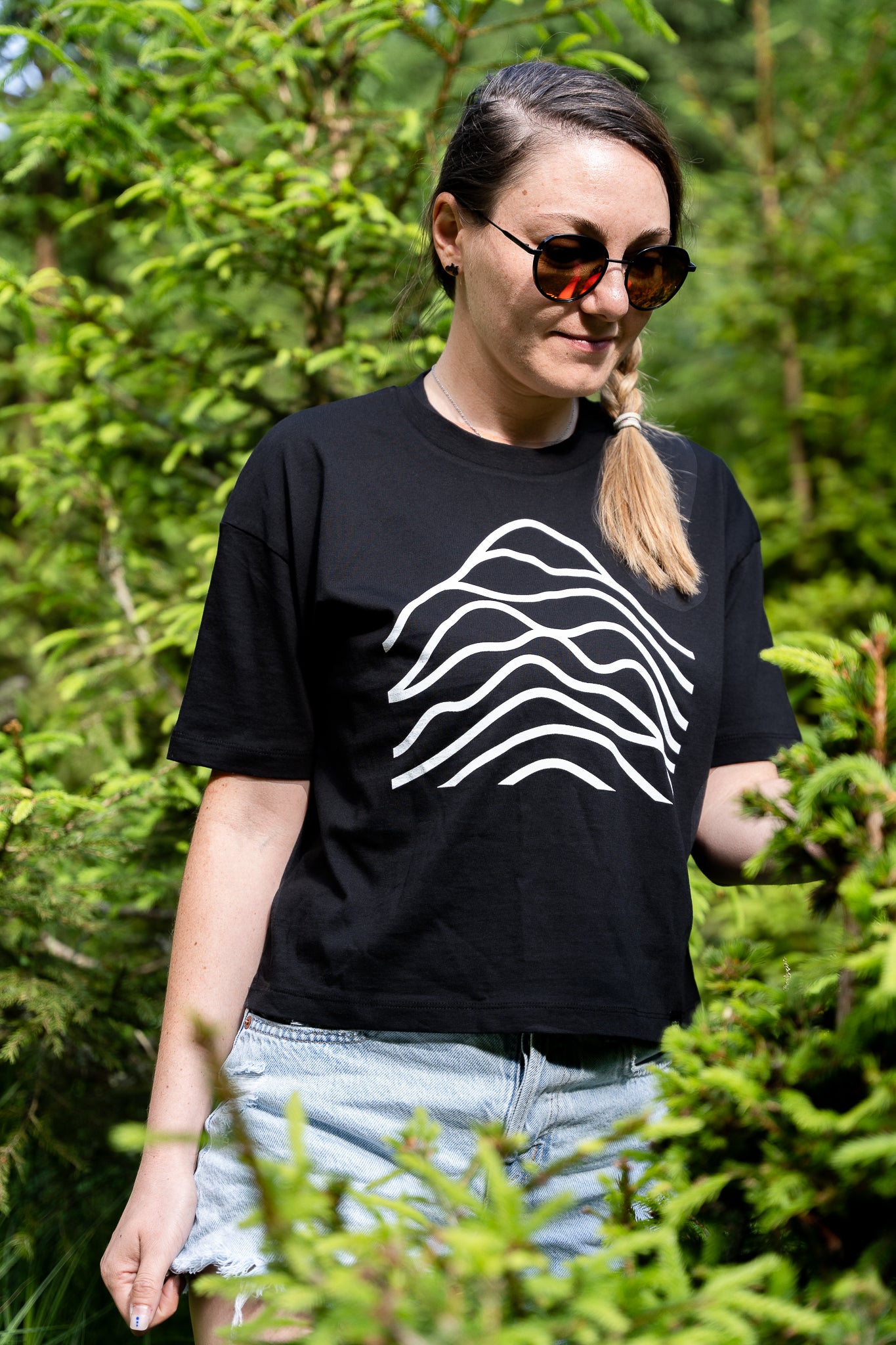 A black cotton t-shirt with a graphic design in white.