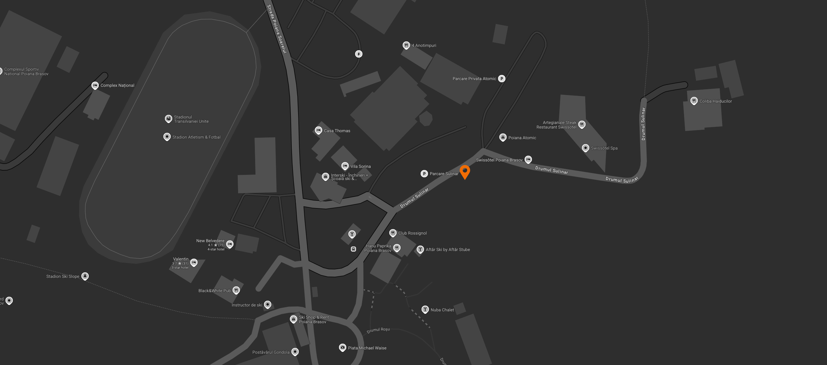 Map with a location marked by an orange pin on a dark background